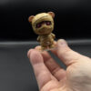 spooky-mummy-main Mummy bear figurine held in hand