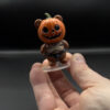 spooky-pumpkin-main Pumpkin bear figurine held in hand